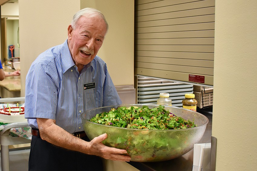 Joe D'Eugenio serves up a big salad.
