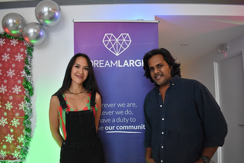 DreamLarge Director Julia Groom and DreamLarge Founder Anand Pallegar welcomes the community to the RADD Holiday Bash.