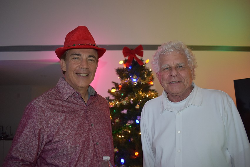 Sid Friedman and David Lough pose in front of the DreamLarge Christmas tree.