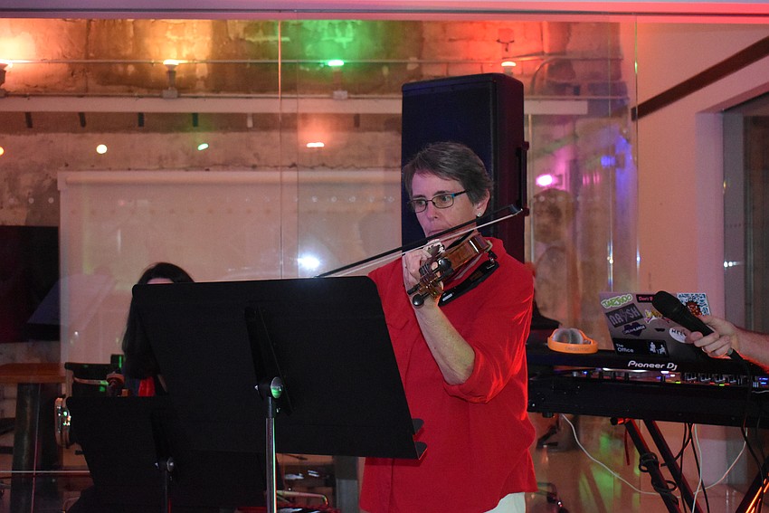 Becky May plays festive tunes on her violin.