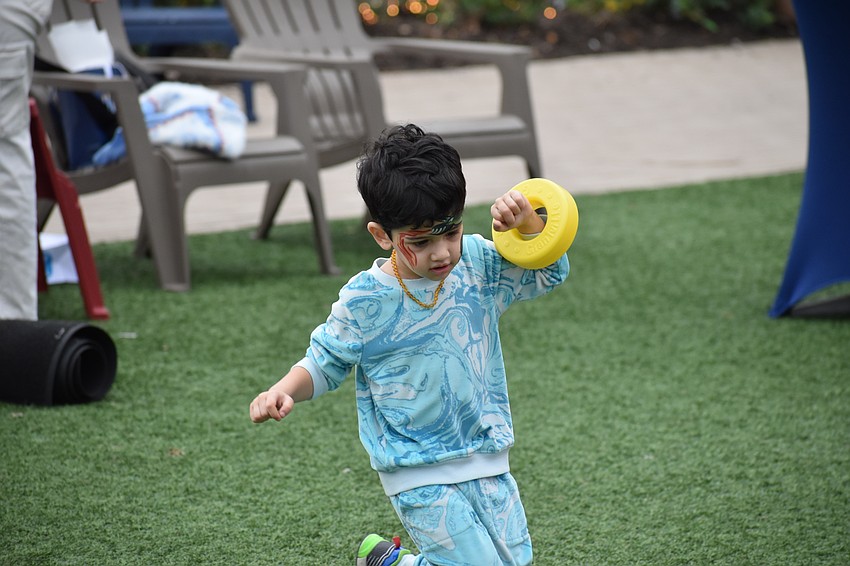 Lakewood Ranch 2-year-old Aiton Weiman makes the rounds on The Green.