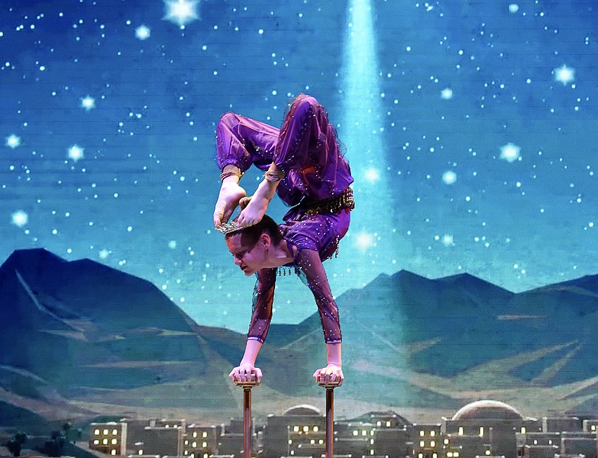 Madison Barrett does hand balance and contortion.