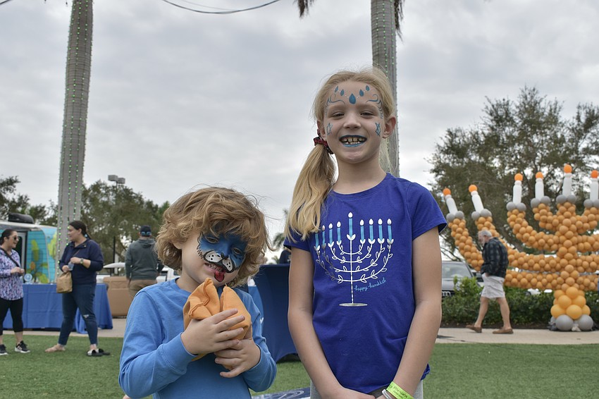 Sarasota's 4-year-old Brody Gates and 7-year-old Dylan Gates immersed themselves in the Hanukkah celebrations.