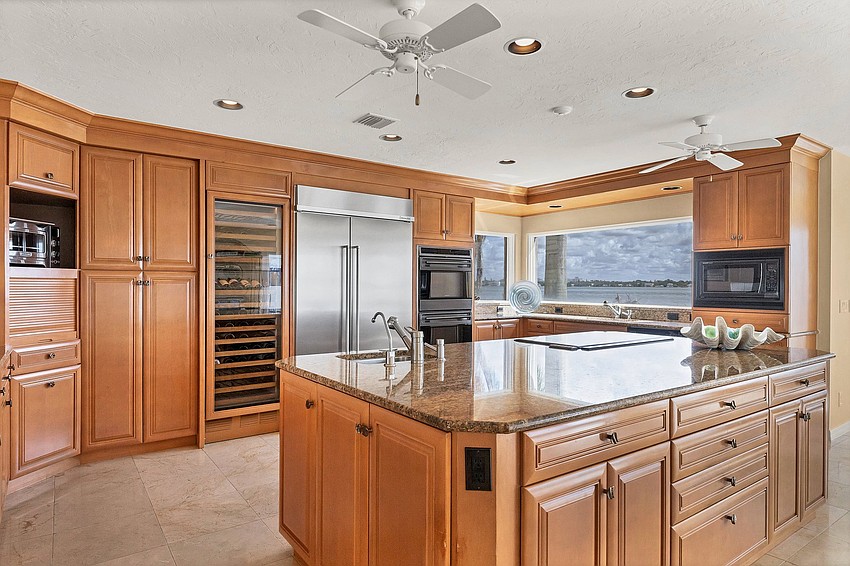 Custom cabinets and granite countertops are featured in the kitchen.