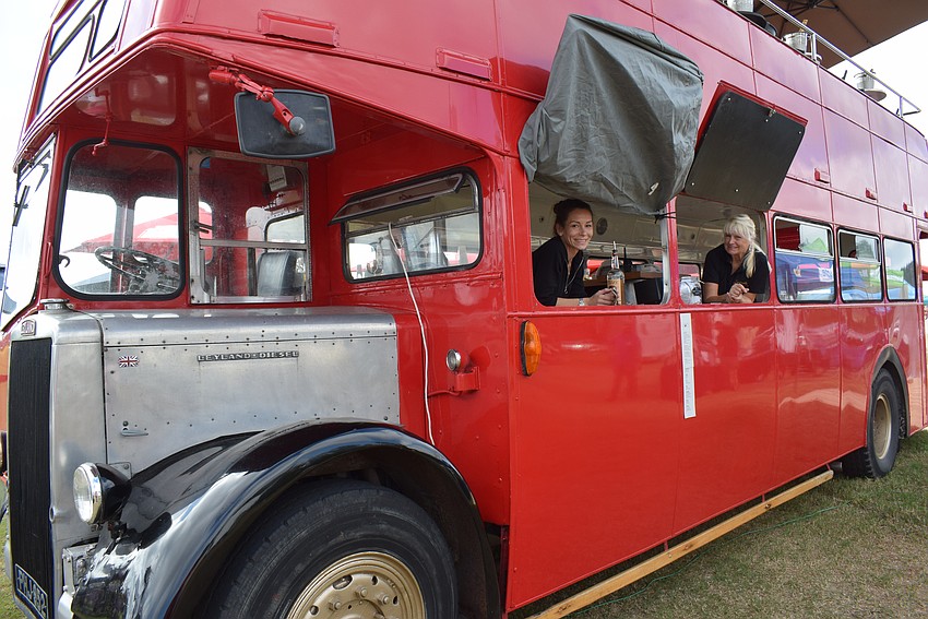 Myakka City's Corrina Nietz and Parrish's Sharon O'Donnell tend bar in the imported Hemingway London bus that made its debut Jan. 1 during the Sarasota Polo Club's season opener.