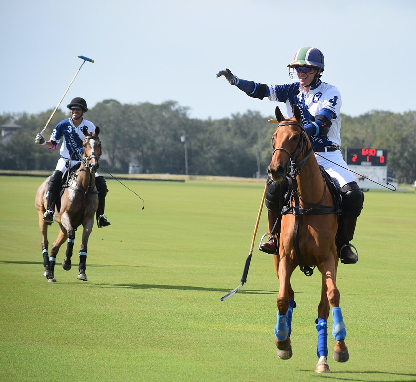 North South Wealth Management/Ranch Hand's Alan Martinez and Stuart Campbell acknowledge the crowd during opening day at the Sarasota Polo Club.