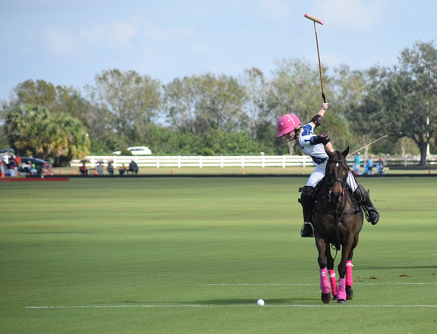 Hanna Hornung of North South Wealth Management/Ranch Hand winds up to let a shot fly in the Sarasota Polo Club season opener.