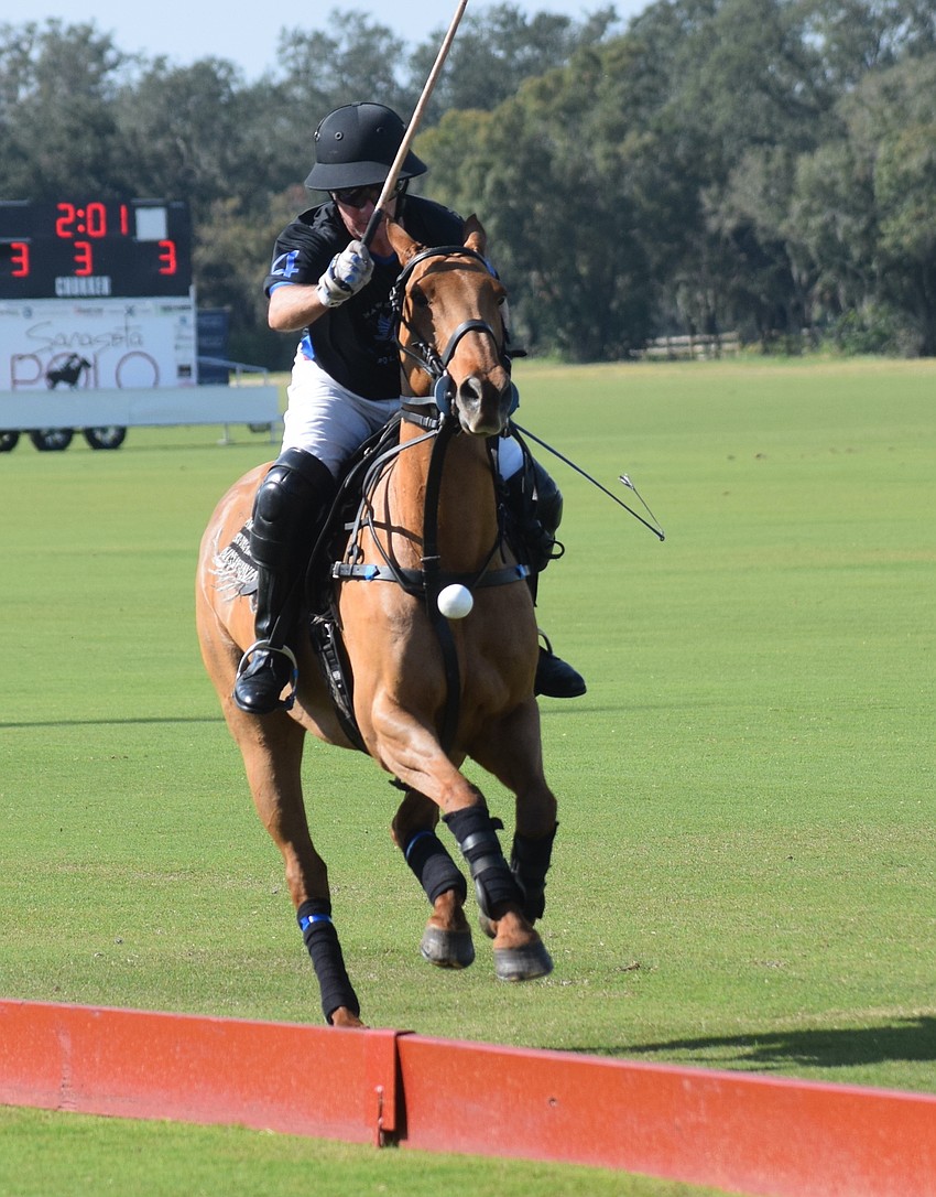 Barefield/Hawkwood's Leandro Berrios unleashes a shot during the season opener at the Sarasota Polo Club on New Year's Day.