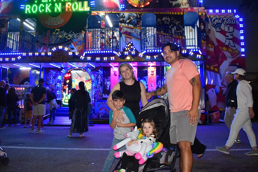 Gunner, Shara, Rudy and Randy Muth enjoy the Dreamland Amusement games.