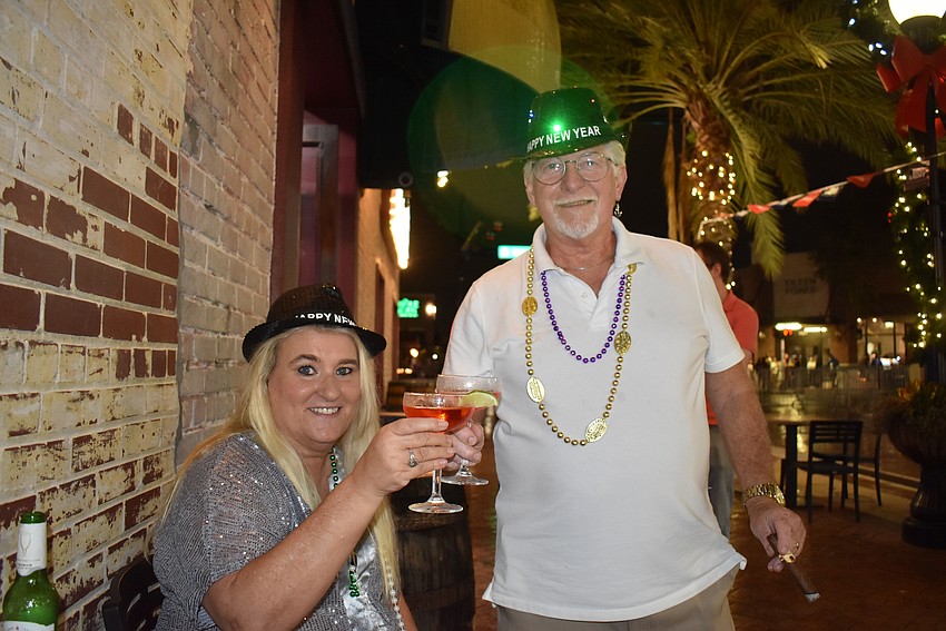 Nancy and Ralph Dennington make a toast for the new year.