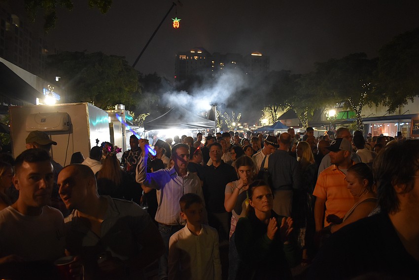 Thousands of people gather under the pineapple for the first hour of the new year.