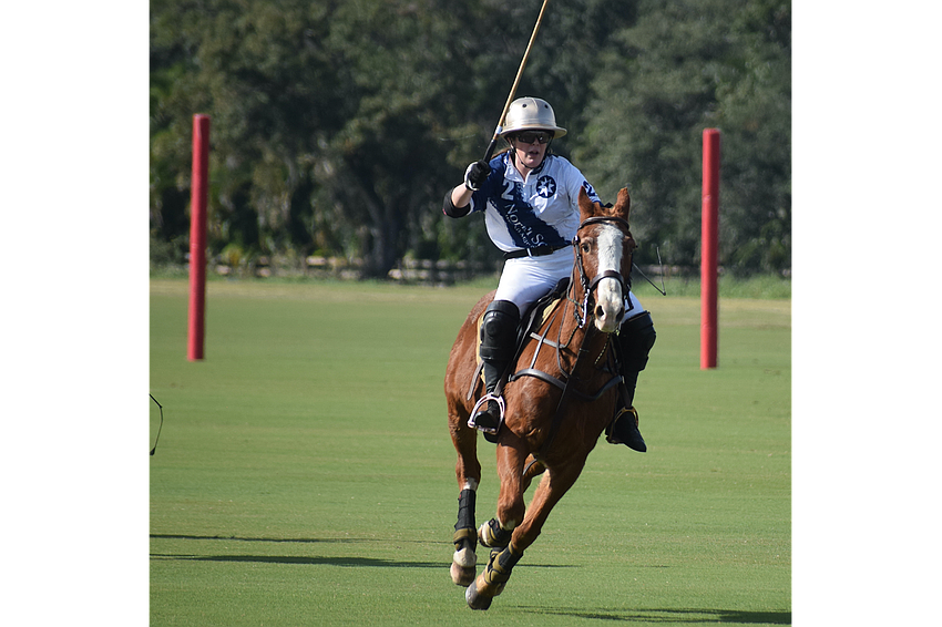 Claire Dornak of the North South Wealth Management/Ranch Hand team watches her long shot down the field in the Sarasota Polo Club's season opener.
