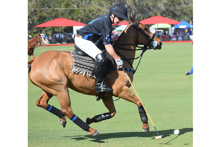 Leandro Berrios controls the ball and rushes up the field for Barefield/Hawkwood during the Sarasota Polo Club's opener.