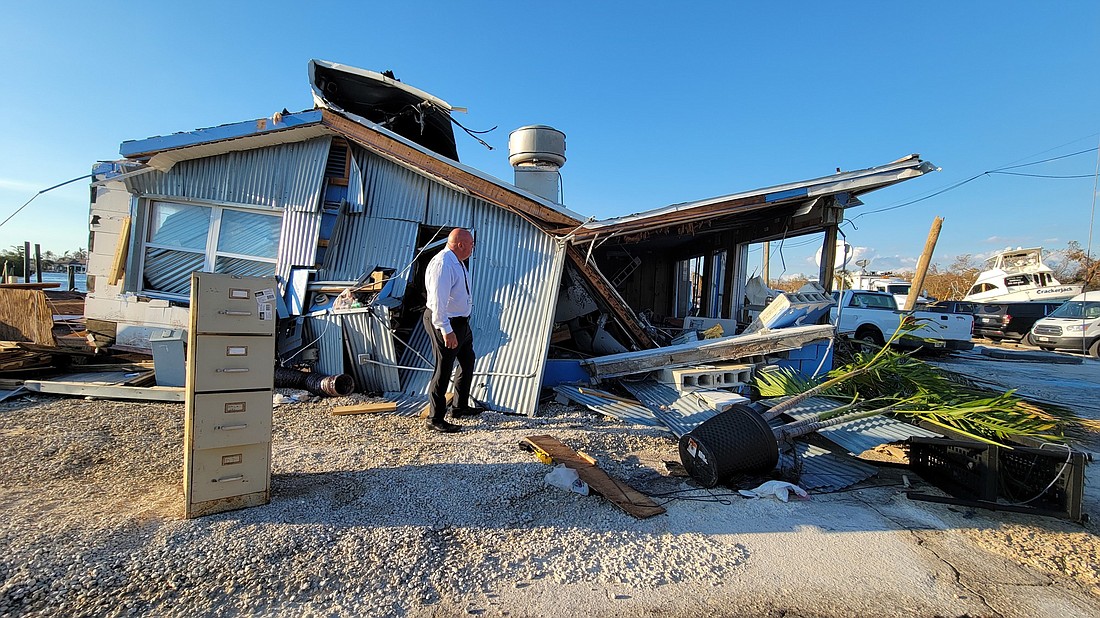 Cecil Pendergrass, chairman of Lee Countyâ€™s Board of County Commissioners, inspects damage after Hurricane Ian. (courtesy photo)