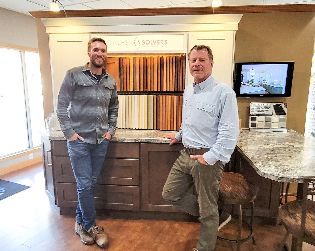 Kitchen Solvers President Zach Nolte, left, and Jon Cummins, the kitchen and bathroom remodeling companyâ€™s new franchise owner in Northeast Florida, at Kitchen Solversâ€™ headquarters in Wisconsin.