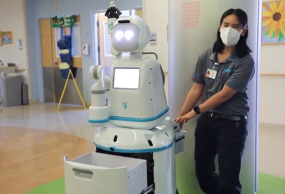 Baptist Medical Center Jacksonville and Wolfson Chidrenâ€™s Hospital are using a Moxi robot to deliver medicine and medical equipment â€“ and pose for selfies.