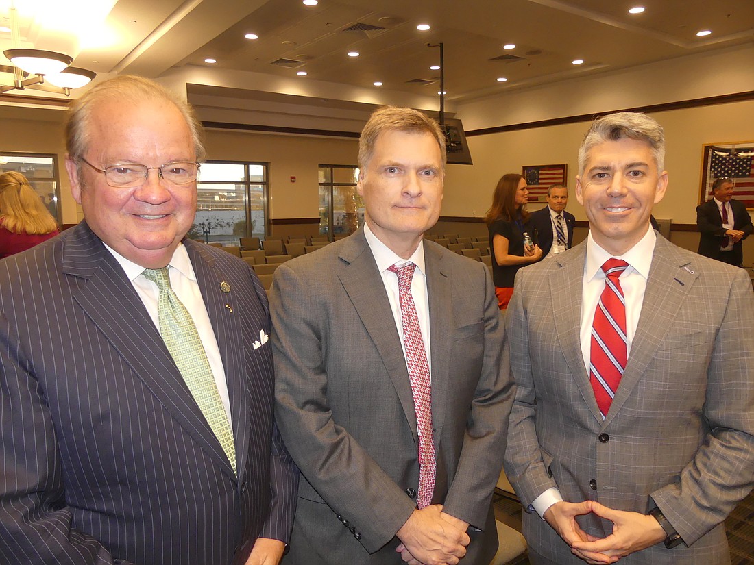 From left, Jacksonville University College of Law founding Dean Nick Allard, state Supreme Court Chief Justice Carlos MuÃ±iz and attorney Patrick Kilbane, president of the Jacksonville Lawyers Chapter of the Federalist Society.