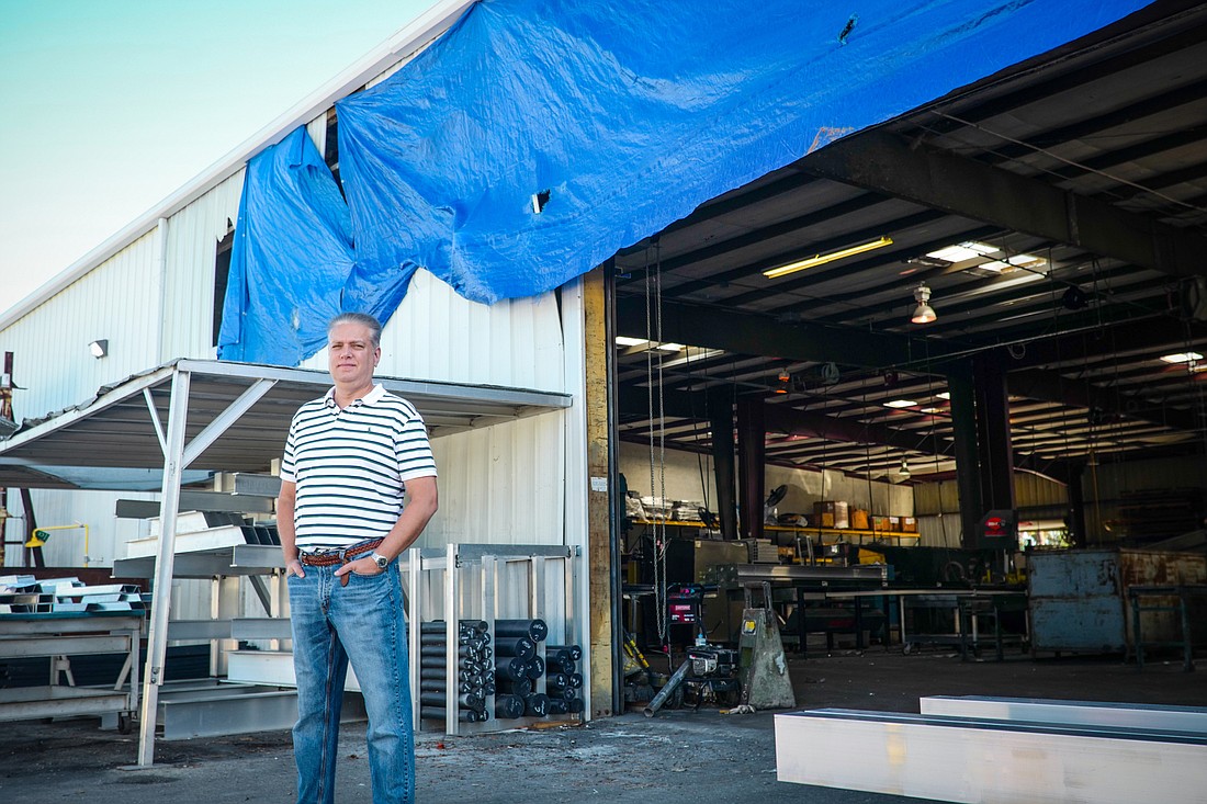 Steven Nanda, president of Fort Myers-based IMM Quality Boat Lifts, at the company&#39;s Ian-damaged Fort Myers manufacturing facility. (Photo by Reagan Rule)