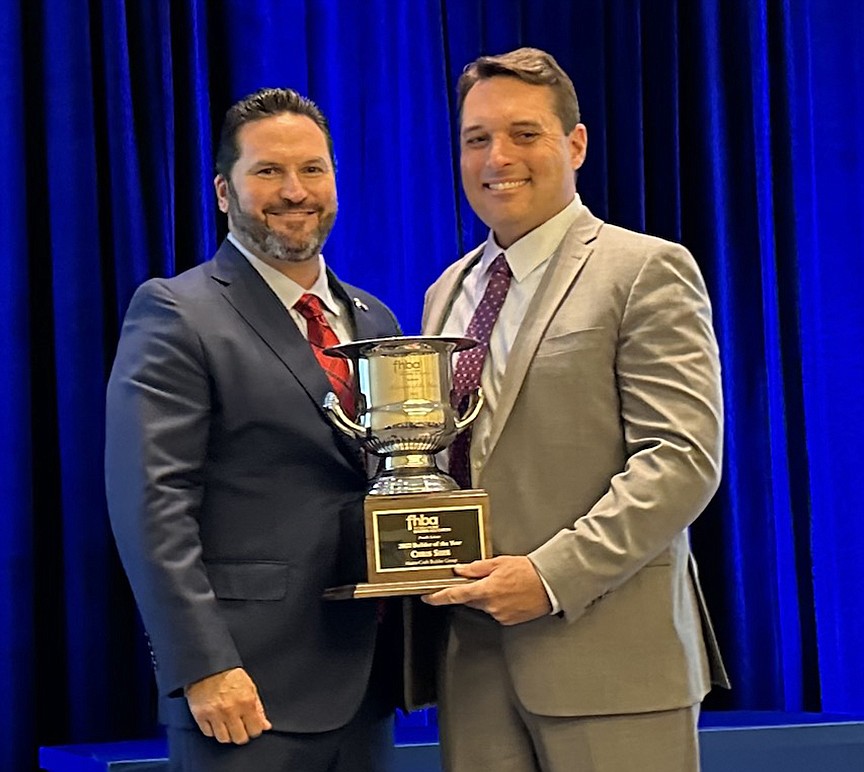 Florida Home Builders Association President TJ Thornberry and 2022 Builder of the Year Chris Shee.