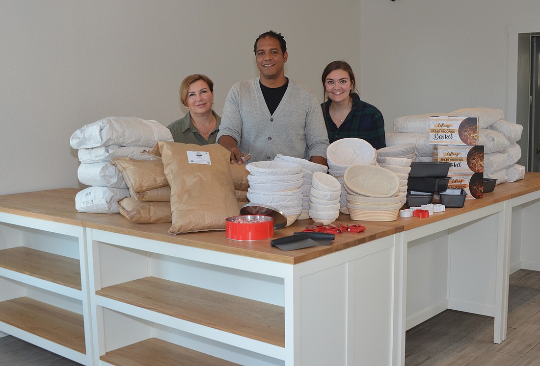 Colin Reichardt, center, is the owner of Beneficial Breads, opening this week in downtown Winter Garden. Olena Ishchenko, left, and Summer Phillips are among the employees hired at the German bakery.