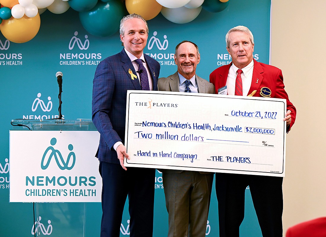 Jared Rice, The Players Championship executive director; Dr. Larry Moss, president and CEO of Nemours Childrenâ€™s Health Jacksonville; and Matthew Welch, The Players 2022 chairman. The tournament donated $2 million to Nemours.