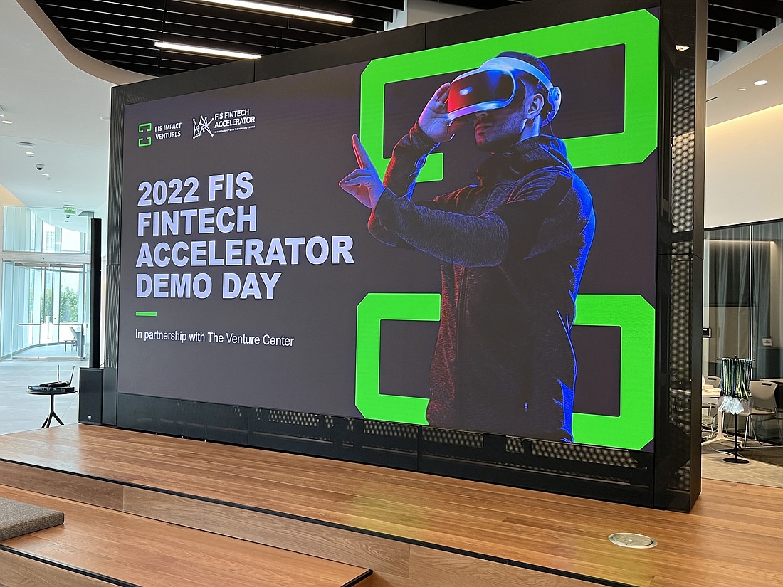 A large video screen promotes the 2022 FIS Fintech Acceleration Demo Day on Nov. 16 at the Innovation Center in the FIS headquarters in Brooklyn.