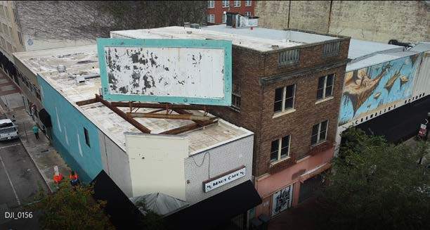 The building is next to Chamblin’s Uptown and Mag's Cafe across the street from the Main Library.