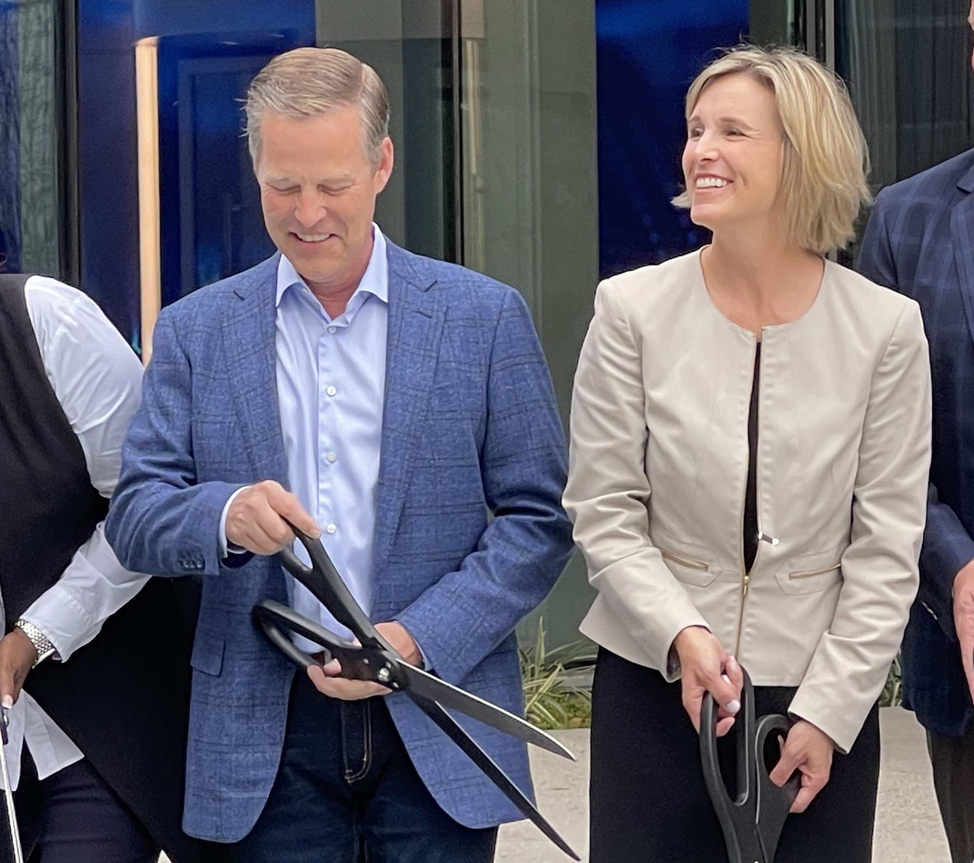 Gary Norcross  and Stephanie Ferris at the Oct. 12 ribbon-cutting ceremony for the new FIS headquarters building on Riverside Avenue. Norcross is now leaving FIS.