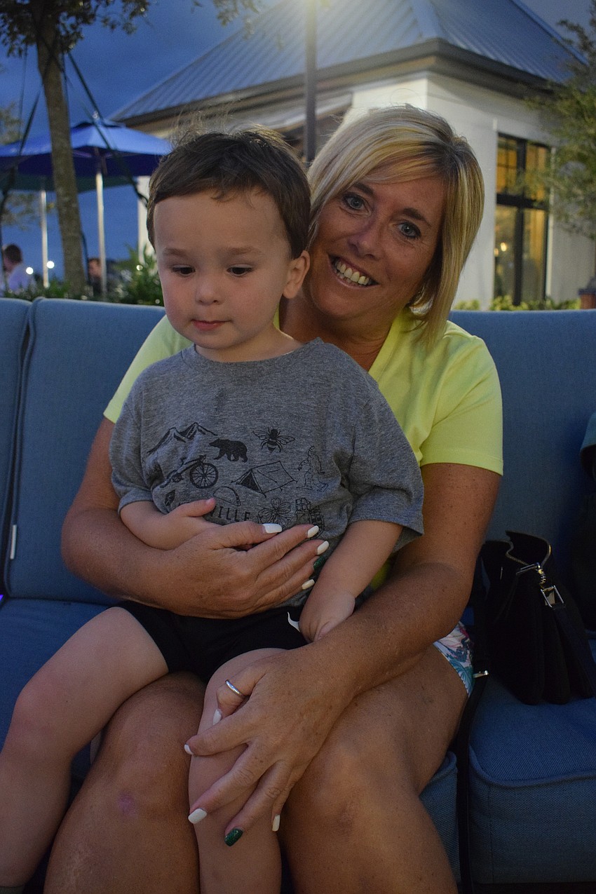 Saratoga, New York 3-year-old Sullivan Shafer has fun visiting his grandmother, Palm Aire's Mary Buono. Buono says he will be dancing because he loves the band Juicy Purple.