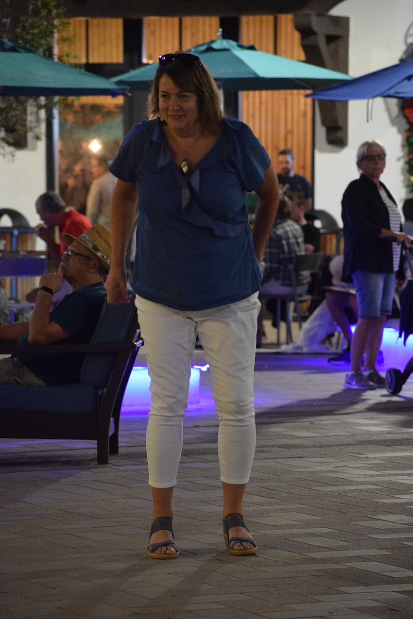 Kim Valone, who is visiting from New York, dances the night away.