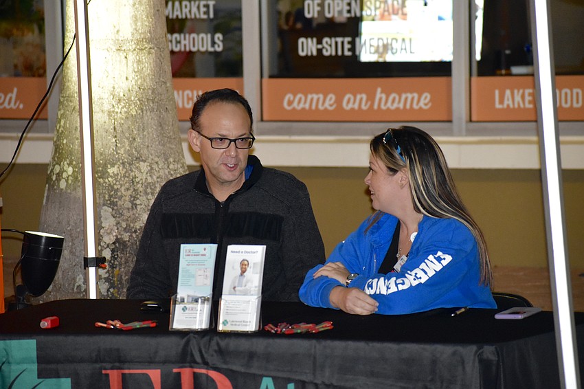 James Livingston and Kristen O'Grady, the director and manager of the ER at Fruitville, an extension of Lakewood Ranch Medical Center, host a booth for the medical center.