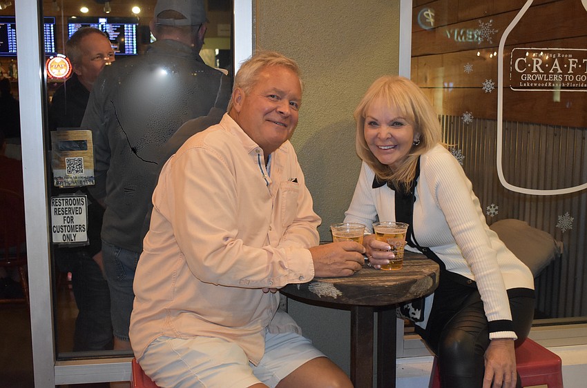 Palmetto's Tom Harvey meets a new friend, Lakewood Ranch's Arlene Menatt, who, like him, is also from Iowa, and shares his love of the Iowa Hawkeyes.