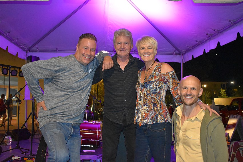 Lisa & the Island Hoppers, who provided live music at the event, includes James Rosati on drums, Al Marnie on bass, Lisa Rott on vocals, and Paul Luther on guitar.