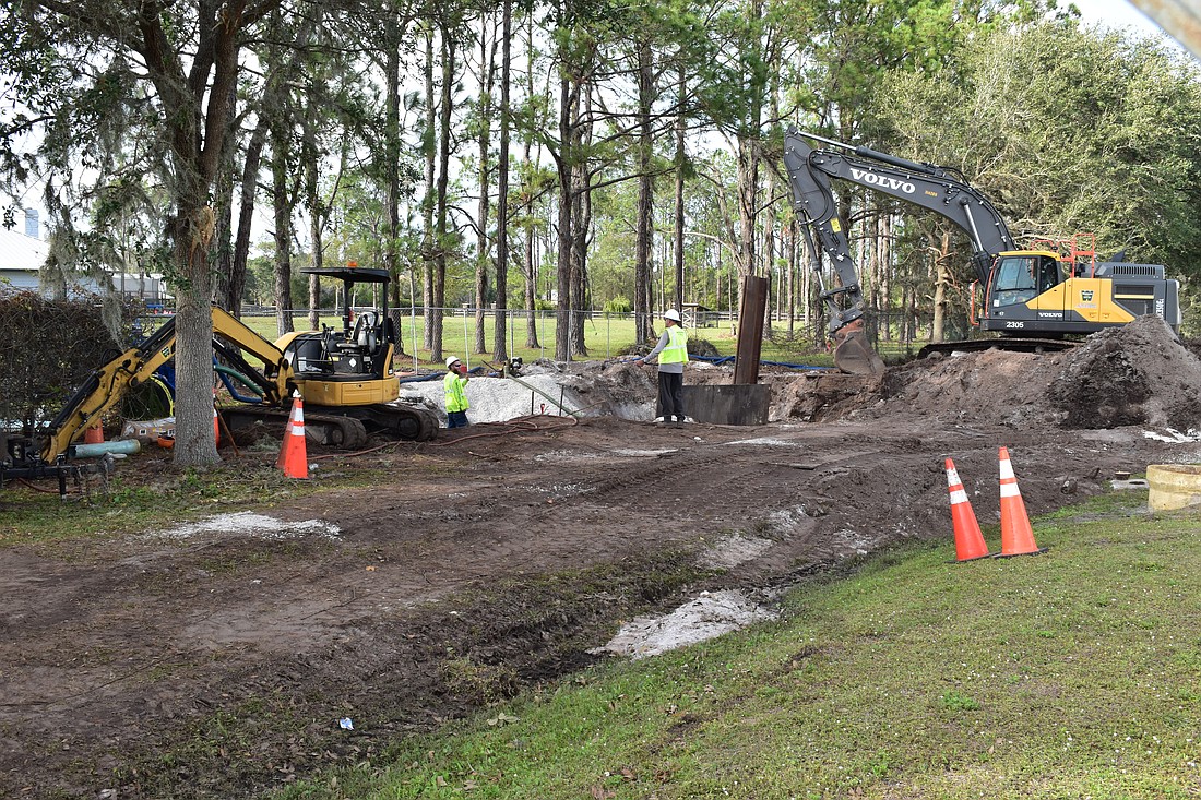 Manatee County workers evaluate a leaking major water pipe on Jan. 4.