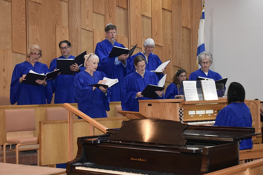 Choirmaster Ann Stephenson-Moe leads the temple's choir for the evening.
