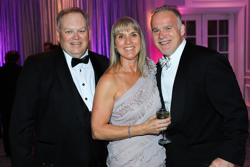 Sarasota Memorial Health Care System president and CEO David Verinder with Libby and Jon Soderbergh