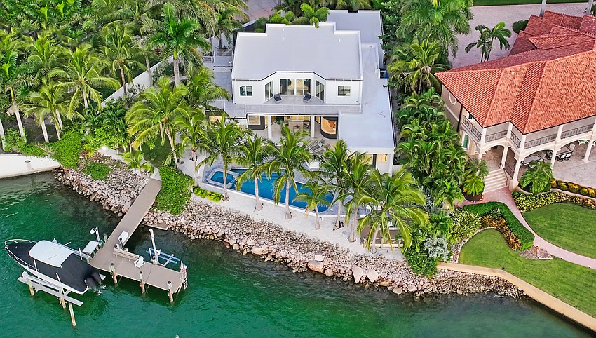 The deep-water dock includes a boat lift with an eight-ton capacity, along with a personal watercraft lift.