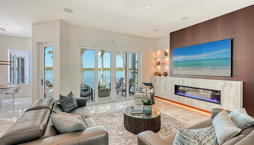 Floors in the living spaces are oversized polished porcelain.