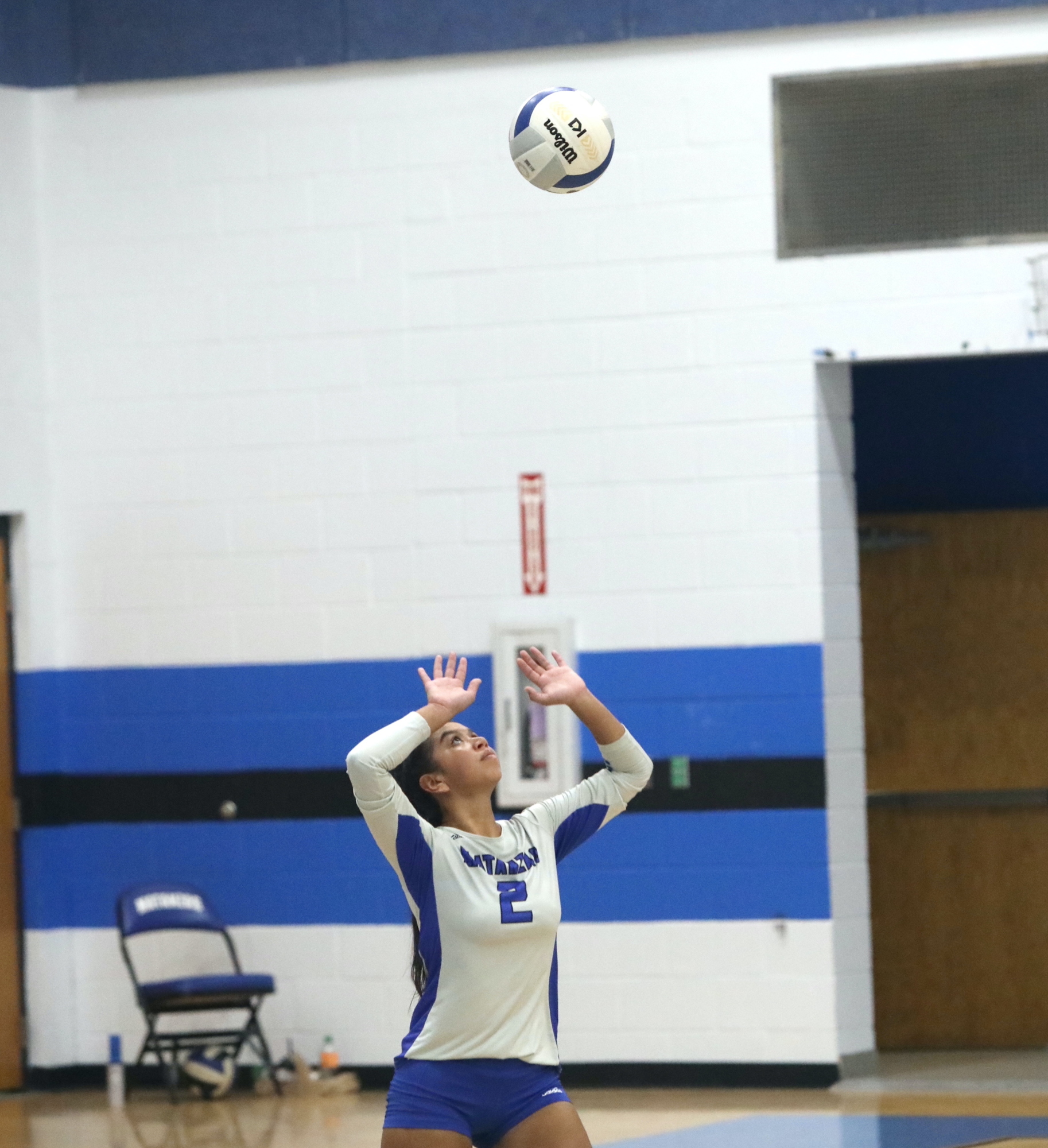 Matanzas senior Sydney Moses sets for a teammate in the Pirates' final home match of the season against Tocoi Creek. Photo by Brent Woronoff