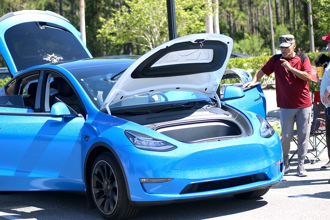 Orlando Pubill shows his Tesla Model Y at Sustainable Flagler's previous Electric Vehicle Showcase on April 9. File photo