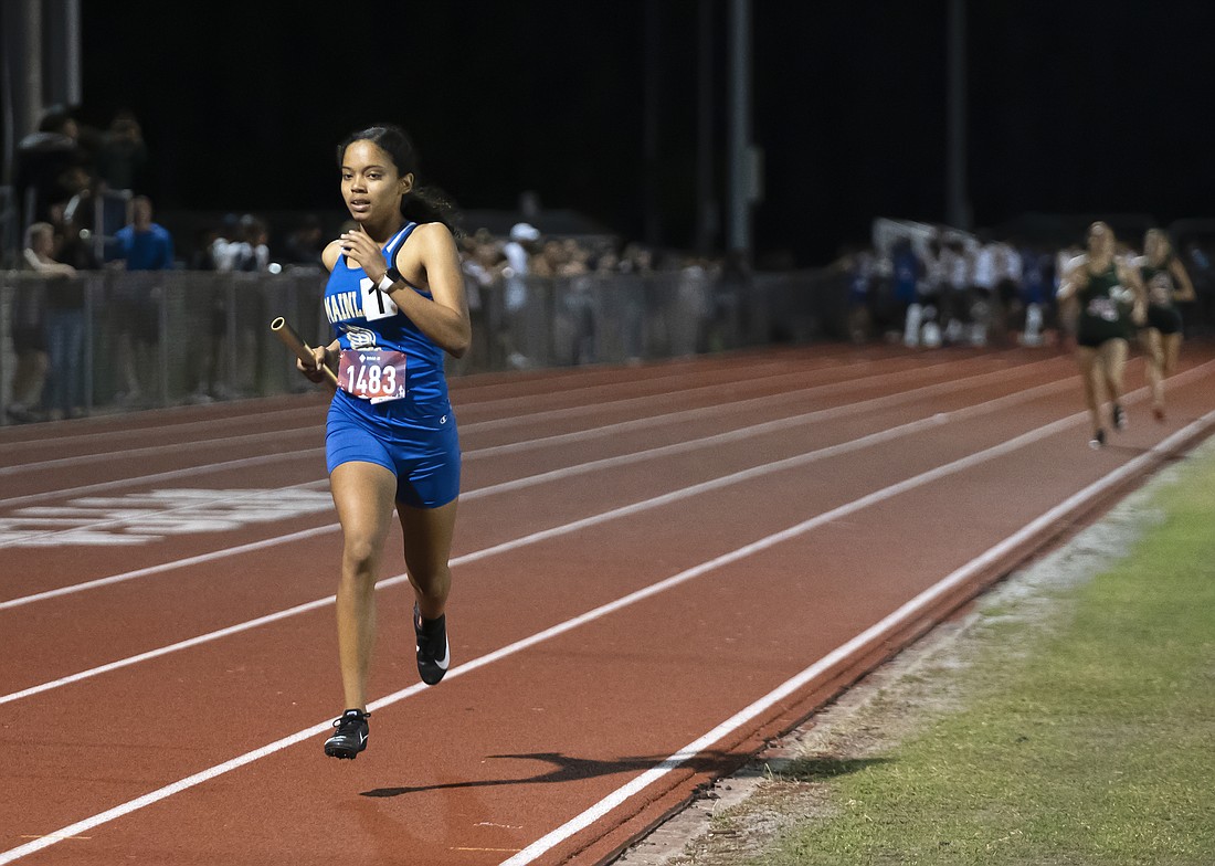 Kiera Williams, here running the 4x400 relay at a track meet, led the Bucs at the District 3-3A cross country meet. File photo by Michele Meyers