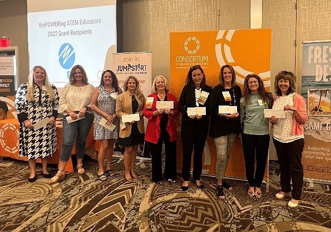 Education foundation leaders from 11 Florida counties, including Flagler County's Teresa Rizzo, fourth from left, were awarded grants from FPL.  Courtesy photo