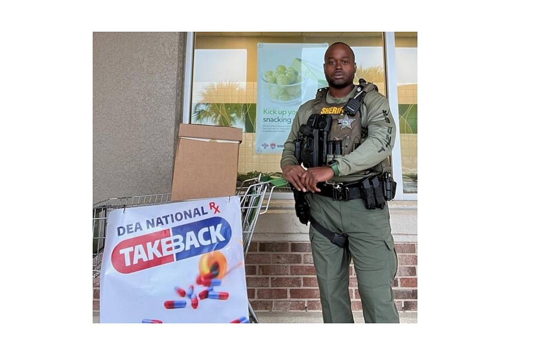 Flagler County Sheriff's Office Deputy Robin Towns at one of the four collection stations in Palm Coast. Photo courtesy of the FCSO