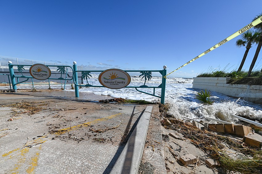 Caution tape warned people of the drop-off created by Hurricane Ian at Andy Romano Beachfront Park immediately after the storm. File photo by Michele Meyers