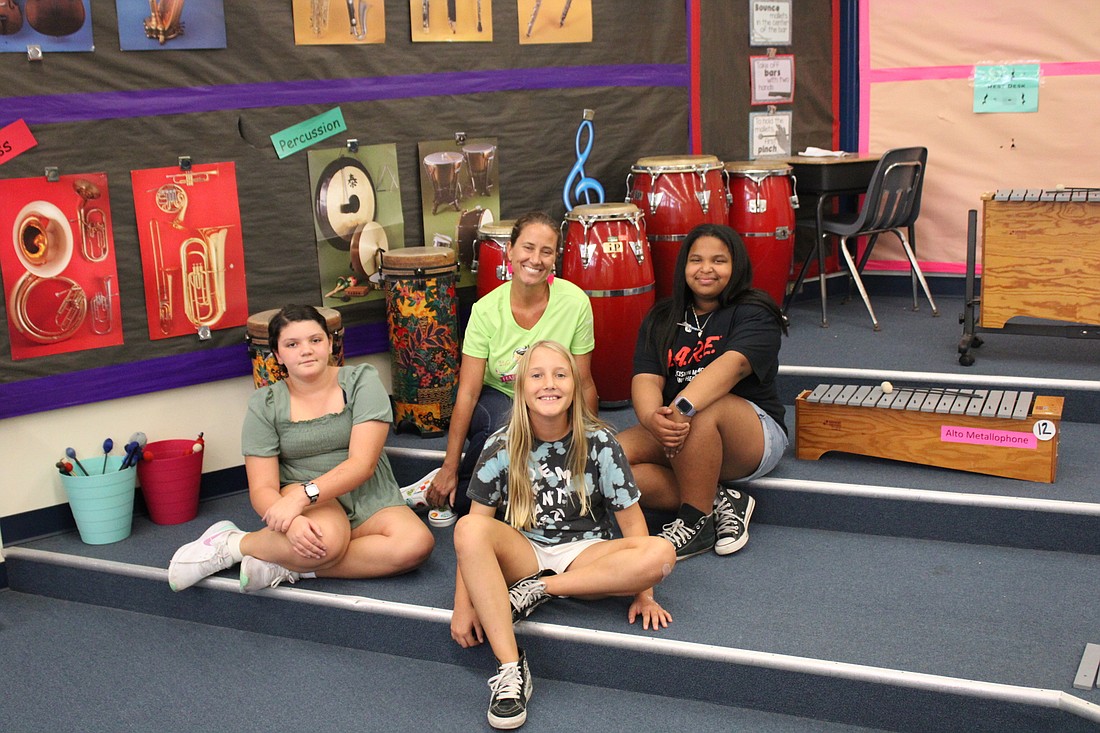 Music teacher, Sarah Johns and students Rena Raymond, Amaya Mathon and Adele Rae Foster. Photo by Alexis Miller