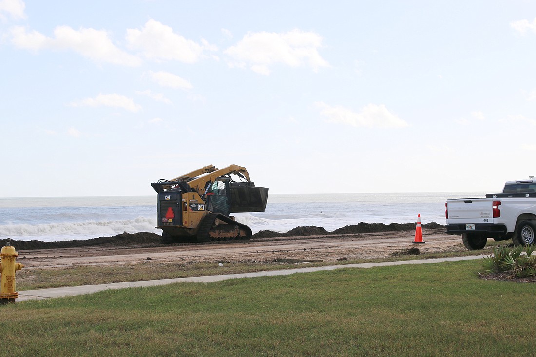 Sand is placed on Friday, Nov. 11, along the affected section of A1A between Wisteria Drive and Sunny Beach Drive. Photo by Jarleene Almenas