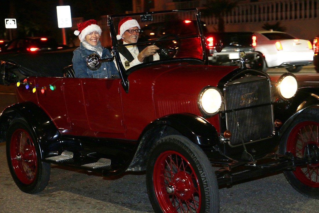 Rita and Brad Krause, of Ormond Beach, ride in their 1927 Ford Model T Touring in the 63rd-annual Gaslight Parade in Ormond Beach on Friday, Nov. 26, 2021. File photo
