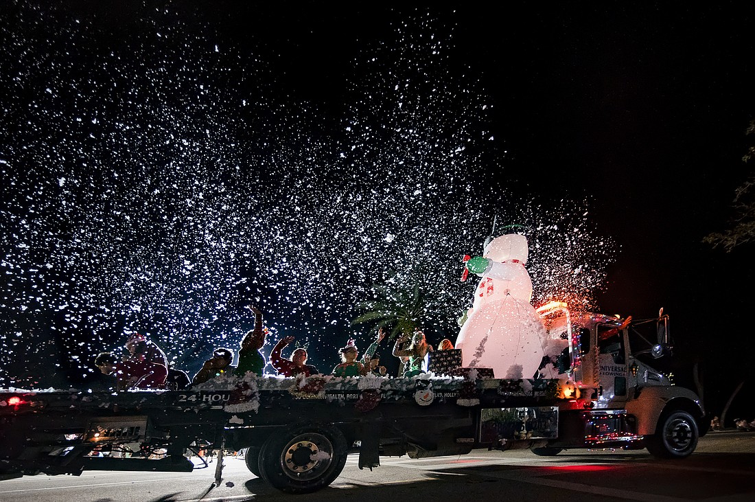 Universal Towing's decorated vehicle won first place at the 30th-annual Home for the Holidays parade. File photo by Michele Meyers