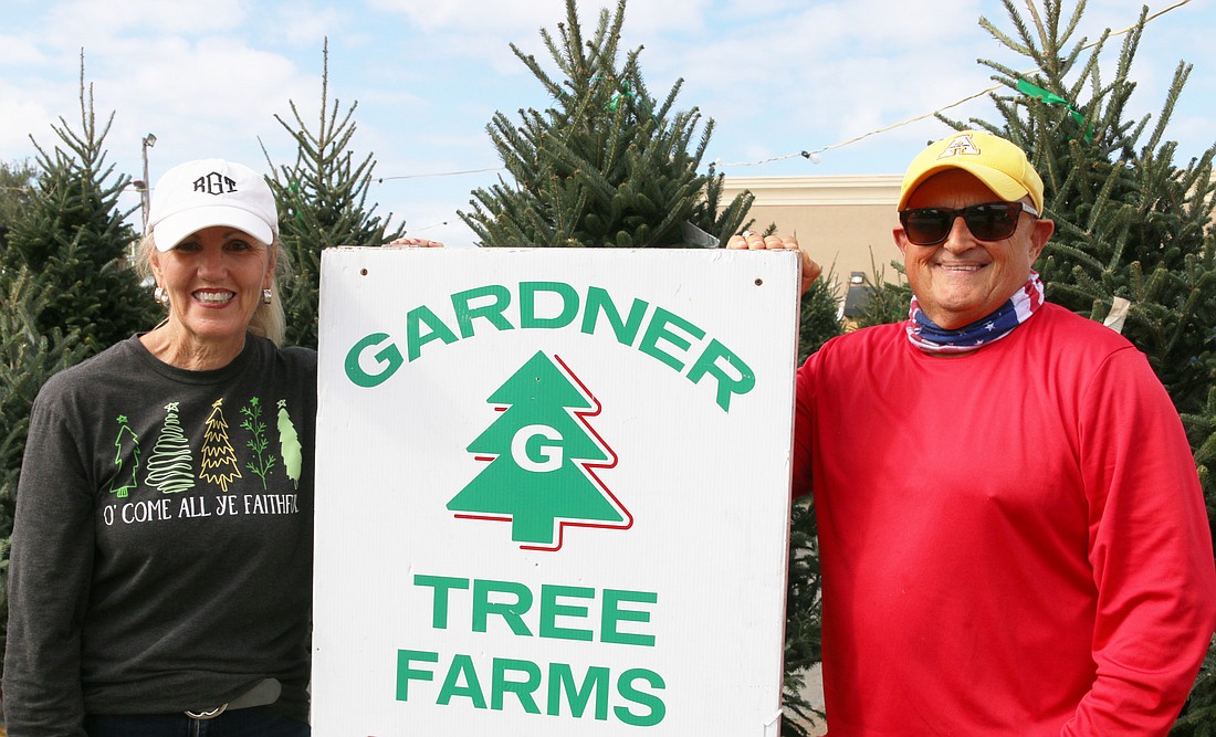 Robin and Michael Gentry have operated Gardner Tree Farms Christmas lot in Ormond Beach for 37 seasons. Photo by Jarleene Almenas