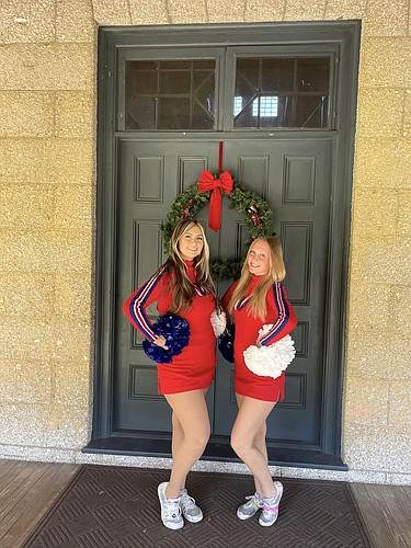 Matanzas cheerleaders Julianna Bogdanov and Kendall Duckett pose in their uniforms for London's New Year's Day Parade. Courtesy photo